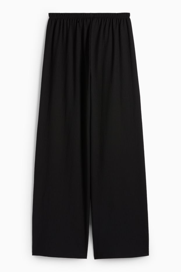 Dona - Pantalons de punt - mid waist - wide leg - texturats - negre