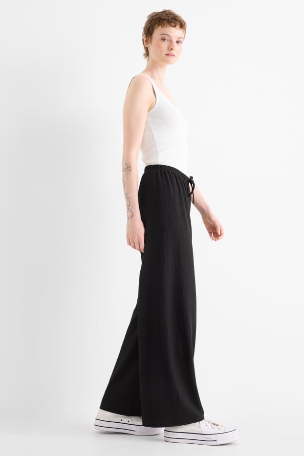 Women - Jersey trousers - mid-rise waist - wide leg - textured - black