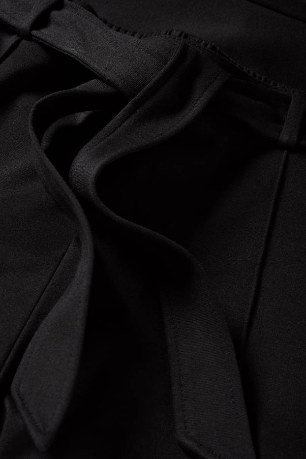 Femei - Pantaloni din jerseu - talie medie - flared fit - negru