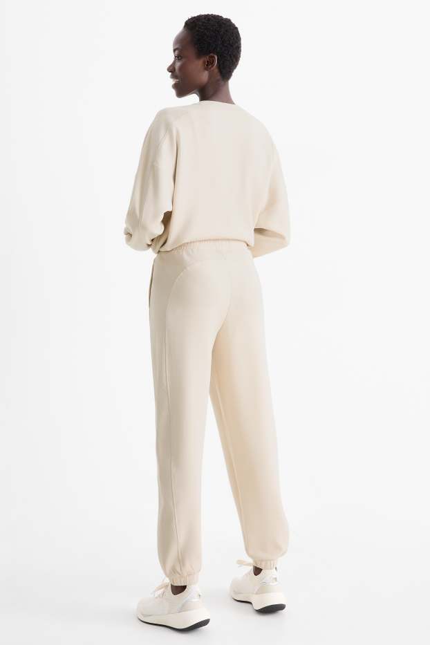 Femei - Pantaloni de sport - bej deschis
